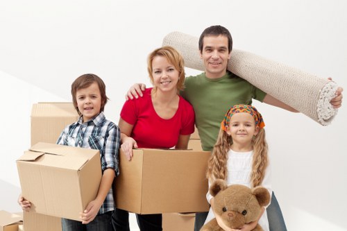 Packers carefully securing household items for a move