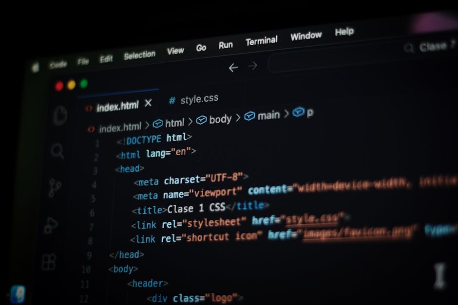 A close-up photograph of a computer screen displaying lines of colorful code in various programming languages, with text in shades of pink, green, yellow, blue, and white. The code includes functions,